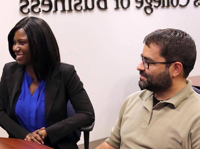 Two students sitting at the school of Business